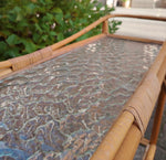 Rottinkinen kukkapöytä pyörillä